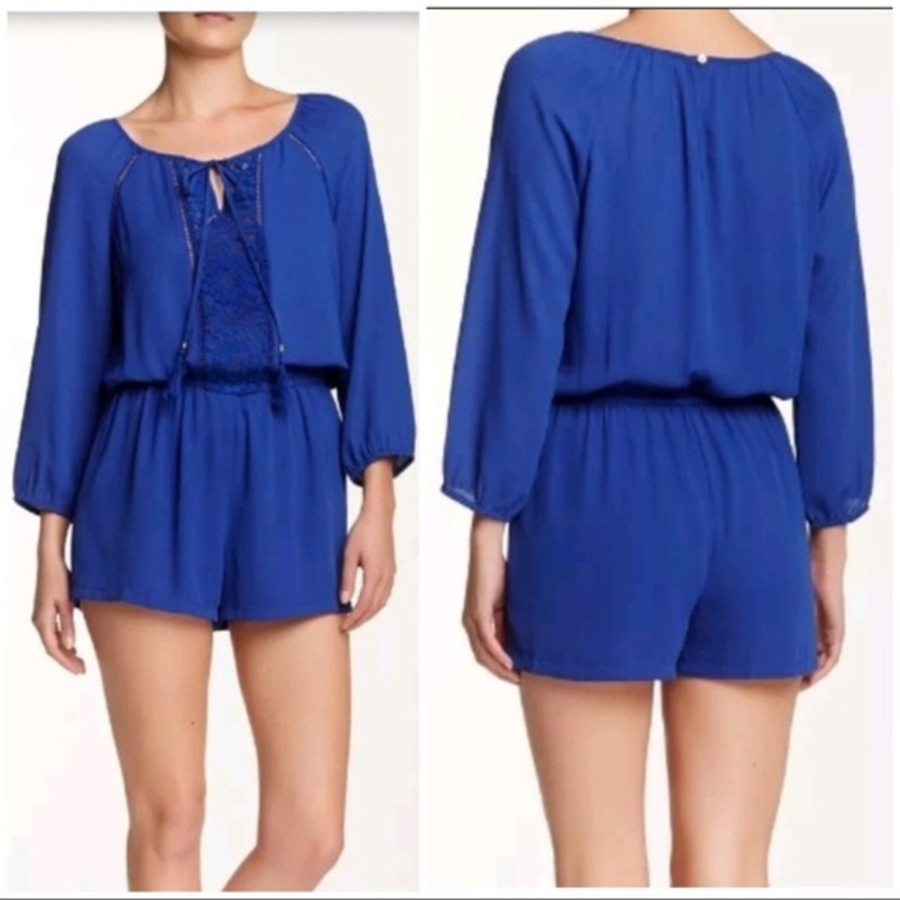 blue long sleeve romper with crochet detail